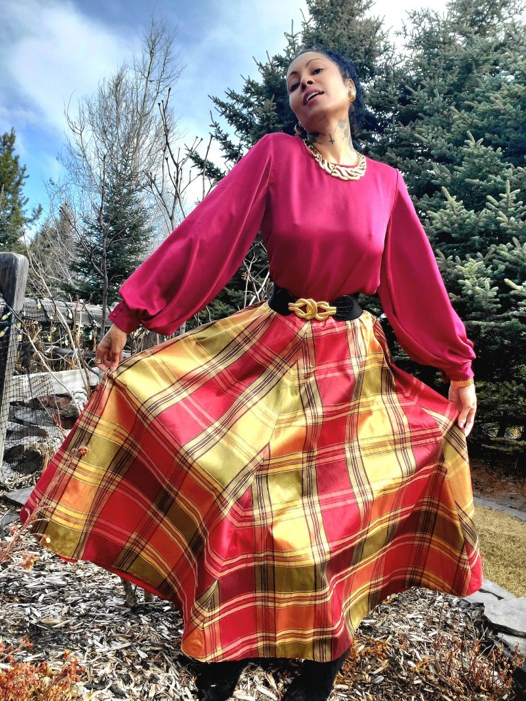 A woman donning a 1990s lime green 2-piece suit skirt set, showcasing a vintage style